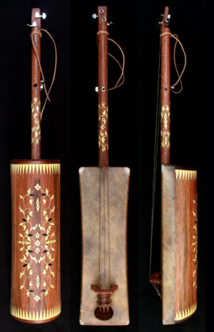 Buy a guembri with tuning keys. Handmade instrument by Hassan Laarousi. Body mahogni and neck mahogni. Decoration lemon tree. Dromedary skin and original goat strings form Morocco. No: 58/120.1 Full length 120 cm. Body 58 cm The price is included a black guembri bag and one/1 set of originial goat strings. (1 set of strings are 3 pieces of goat strings ) Price: 300 Euro SOLD to a musician from France Accessories for guembri instrument Ordering and shipping Various of guembri, #guembrihassan,