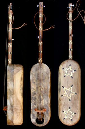 gnawa´s musical instrument play guembri guembri for sale de guembri, la guembri gnaouacuture Moroccan Sintir also called Guembri bass guitar De Marokkaanse basguitar guembri tuning what is the correct tuning for the 3 stringed morrocan bass How to tune the guimbri